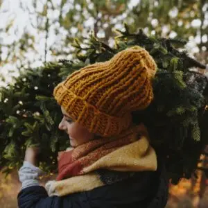 Carrying the Christmas Tree She Just Cut